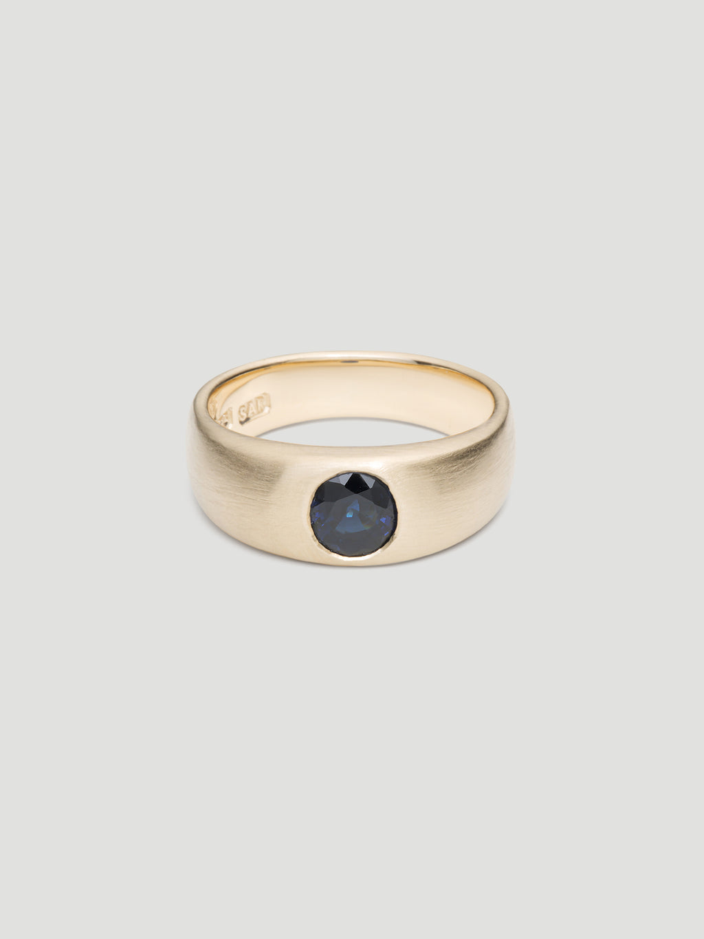 030 - "NOCTURNE" BLUE SAPPHIRE 9K YELLOW GOLD CIGAR BAND
