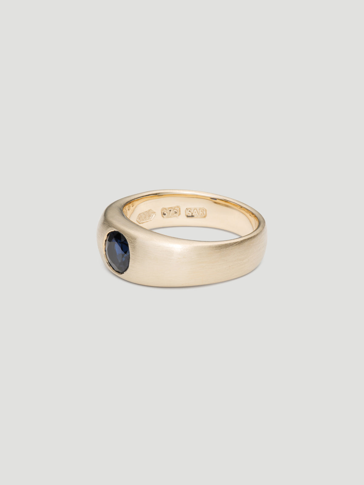030 - "NOCTURNE" BLUE SAPPHIRE 9K YELLOW GOLD CIGAR BAND