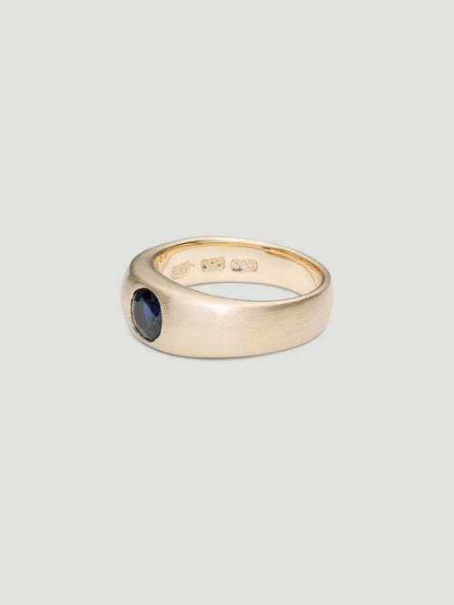 030 - "NOCTURNE" BLUE SAPPHIRE 9K YELLOW GOLD CIGAR BAND