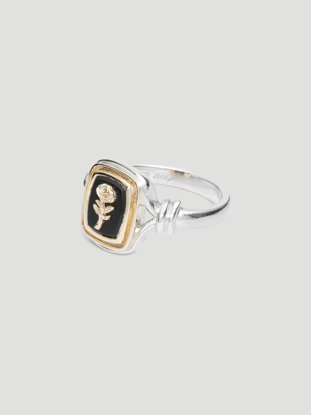 029 - "NOIR" BLACK ONYX 9.25 STERLING SILVER AND 9K GOLD SIGNET RING
