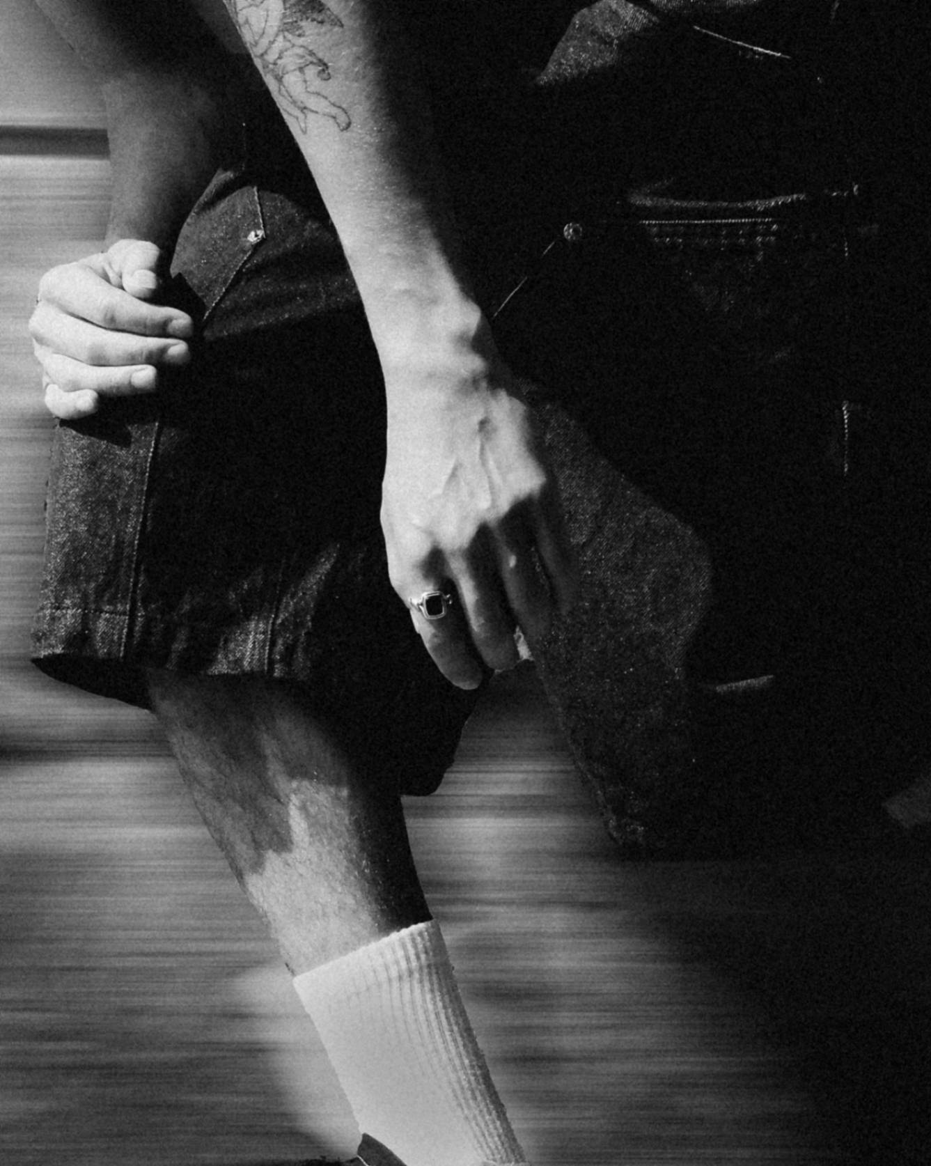 man pushing on a skateboard with a sterling silver ring
