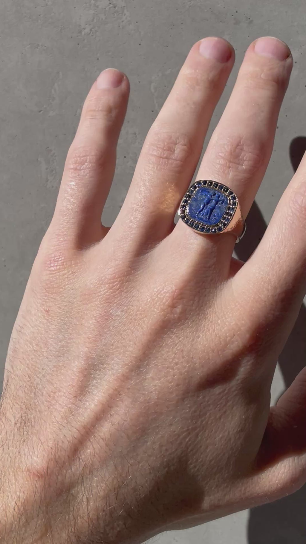 032 - "PSYCHE & EROS" LAPIS LAZULI AND AUSTRALIAN SAPPHIRE 9K YELLOW GOLD SIGNET RING