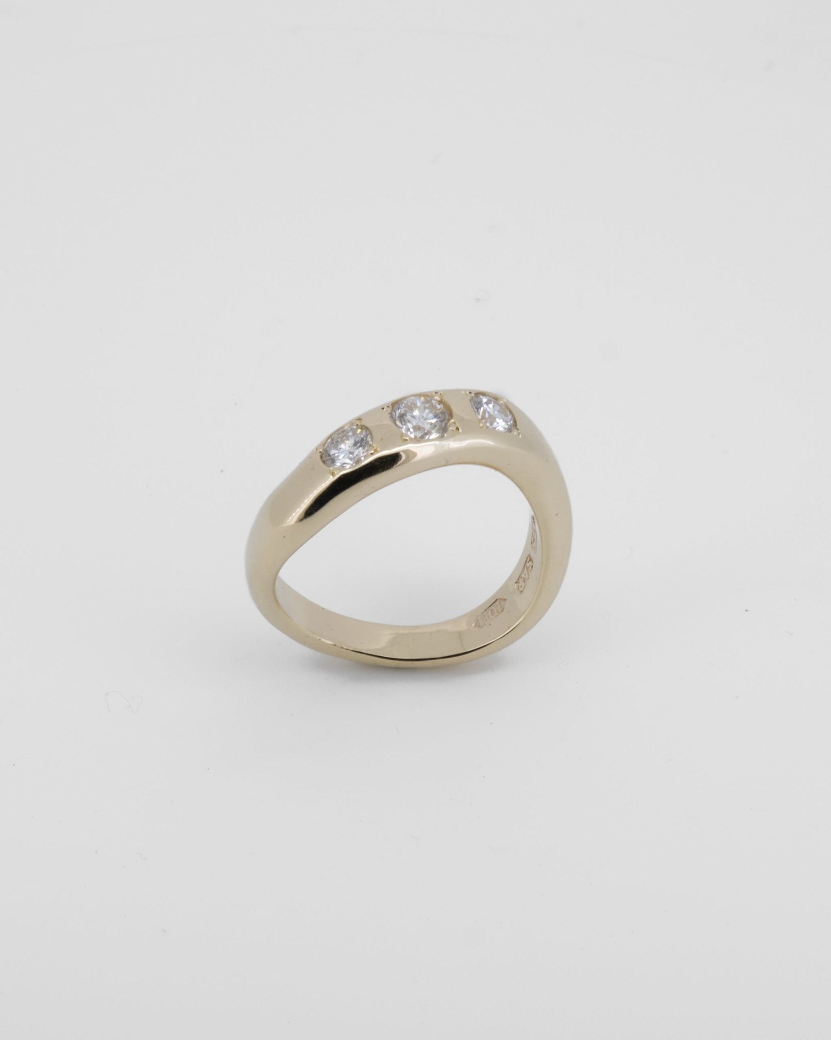 Wavy half round band made in 9kt yellow gold with re - purposed white diamonds. - Sar Jewellery