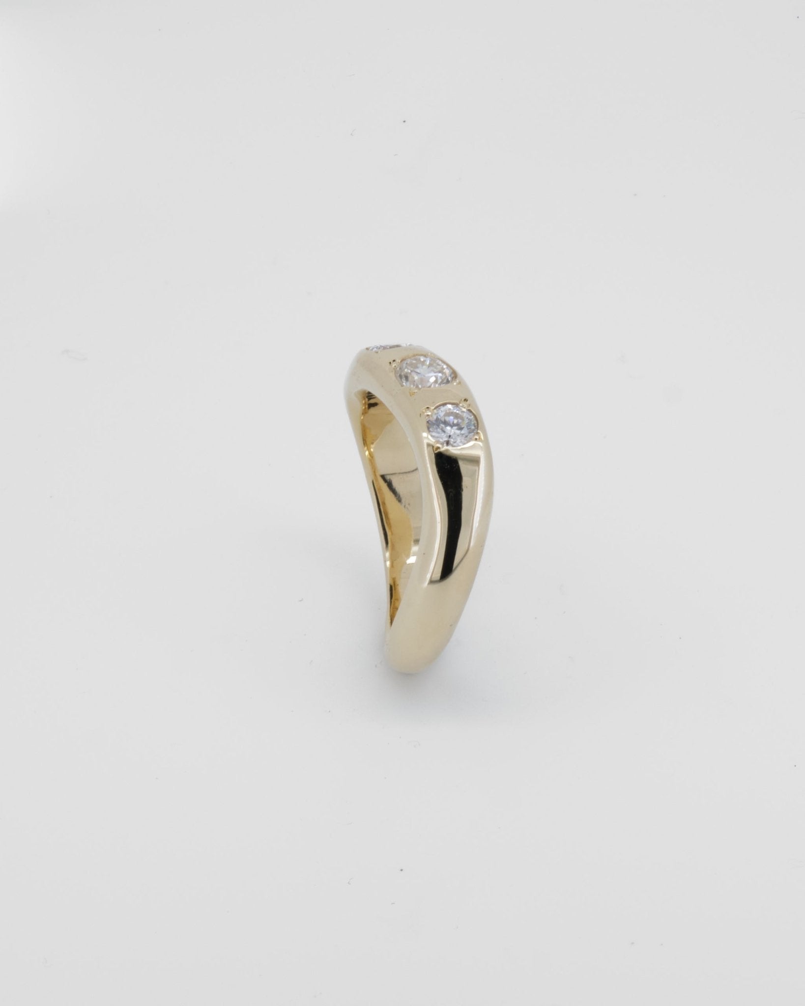 Wavy half round band made in 9kt yellow gold with re - purposed white diamonds. - Sar Jewellery